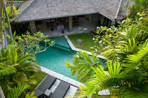 Private villa and pool surrounded by planting